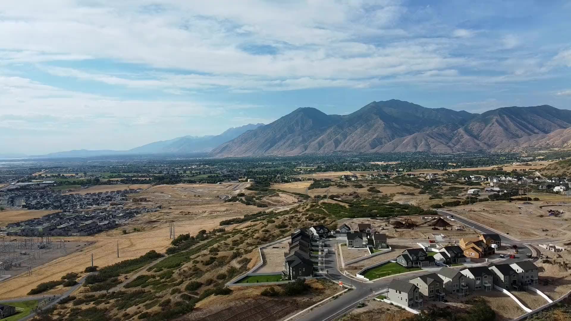 Aerial view of Harmony Ridge in Mapleton, Utah — new homes beneath Maple Mountain at the mouth of Spanish Fork Canyon