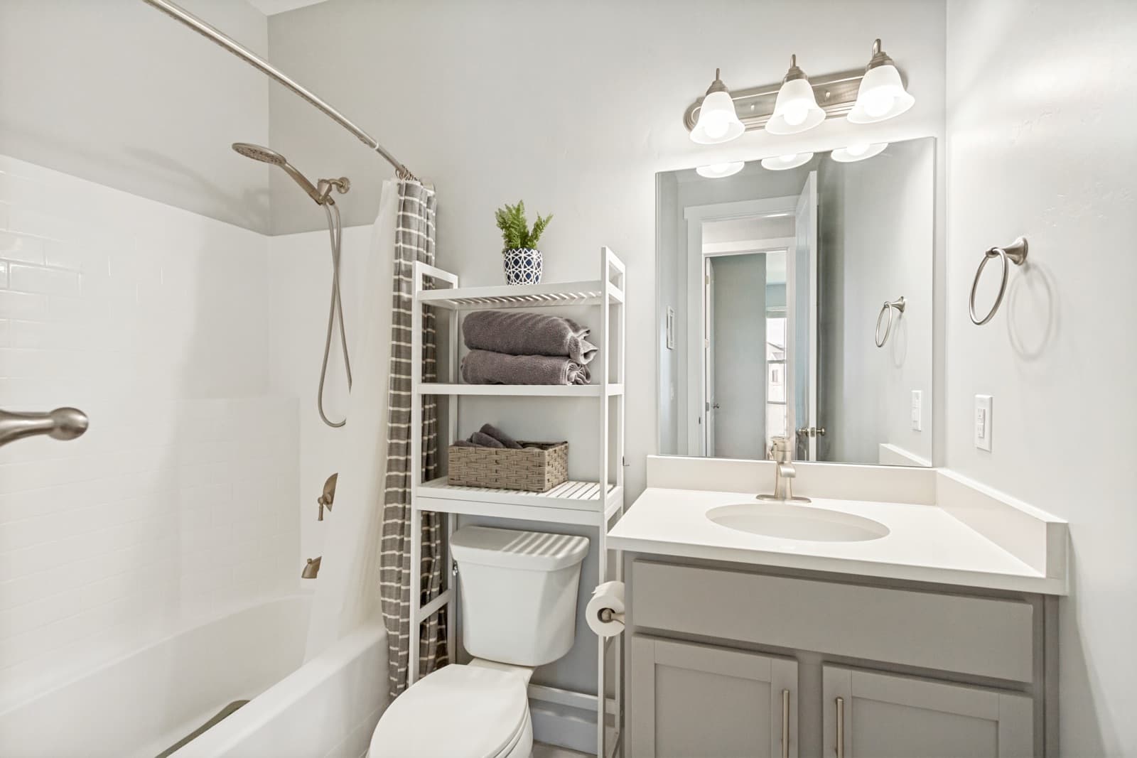 Main hall bath with a vanity and a tub-shower