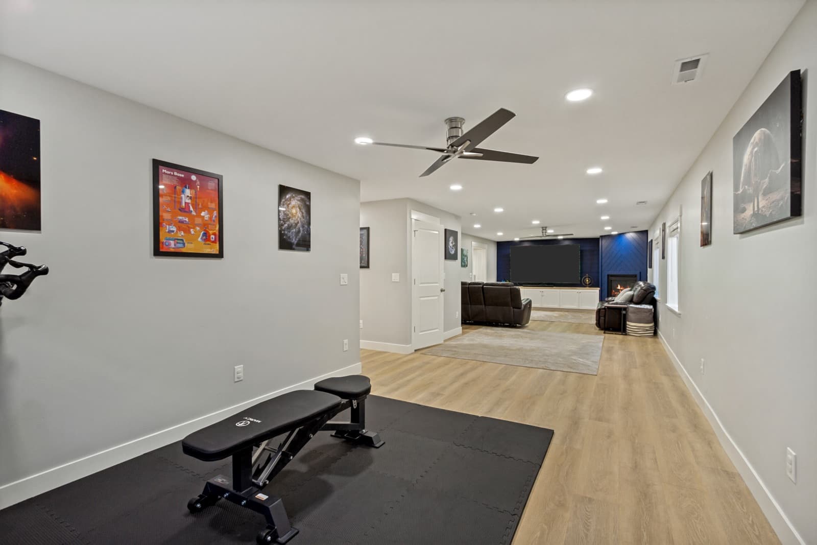 Full length of the basement rec room, from the gym corner to the family room