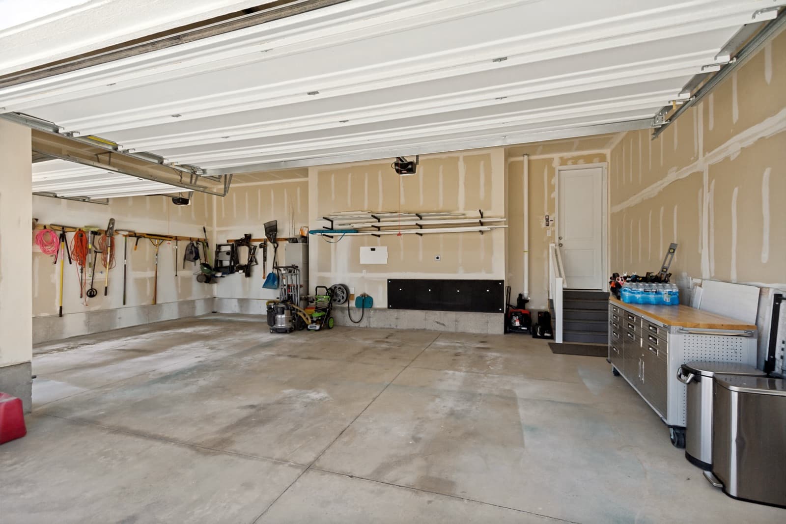 Three-car garage interior with wall storage