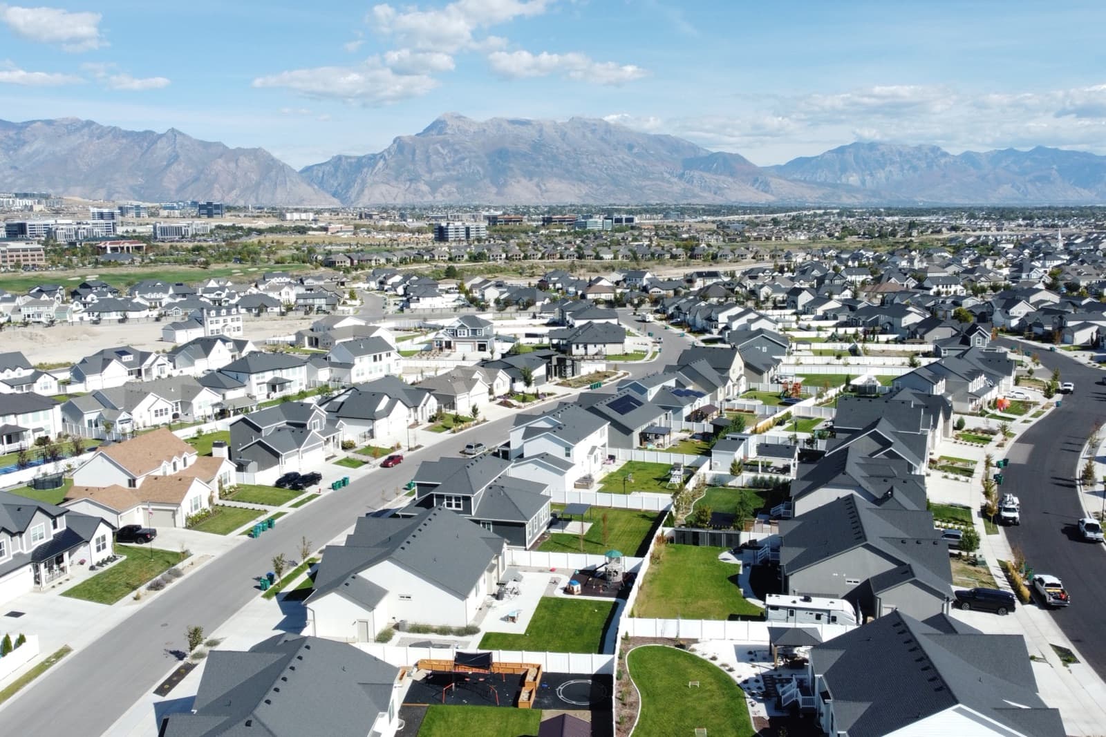 Aerial view of the neighborhood with the Wasatch mountains beyond