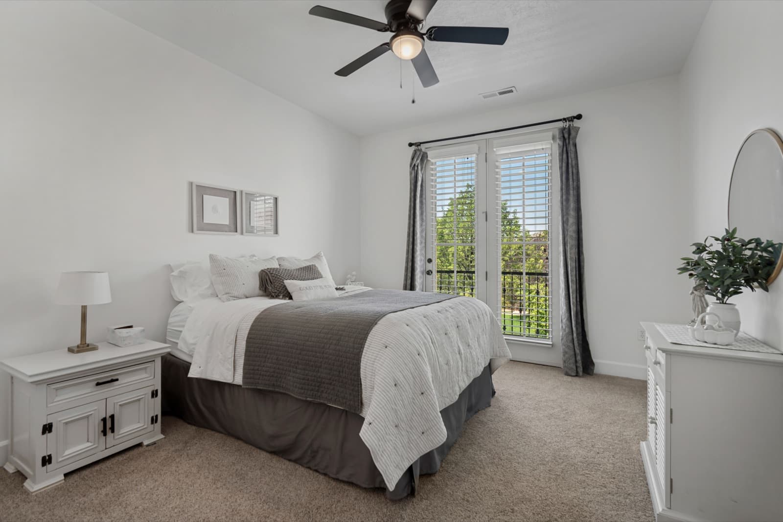 Third bedroom with a vaulted ceiling and a French door to the deck